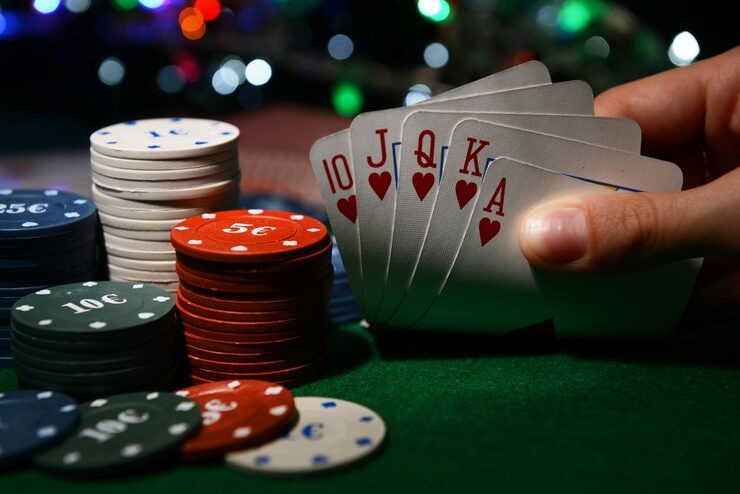Live chat interface on mobile phone showing dealer message and player messages in a collapsible panel during a live blackjack table